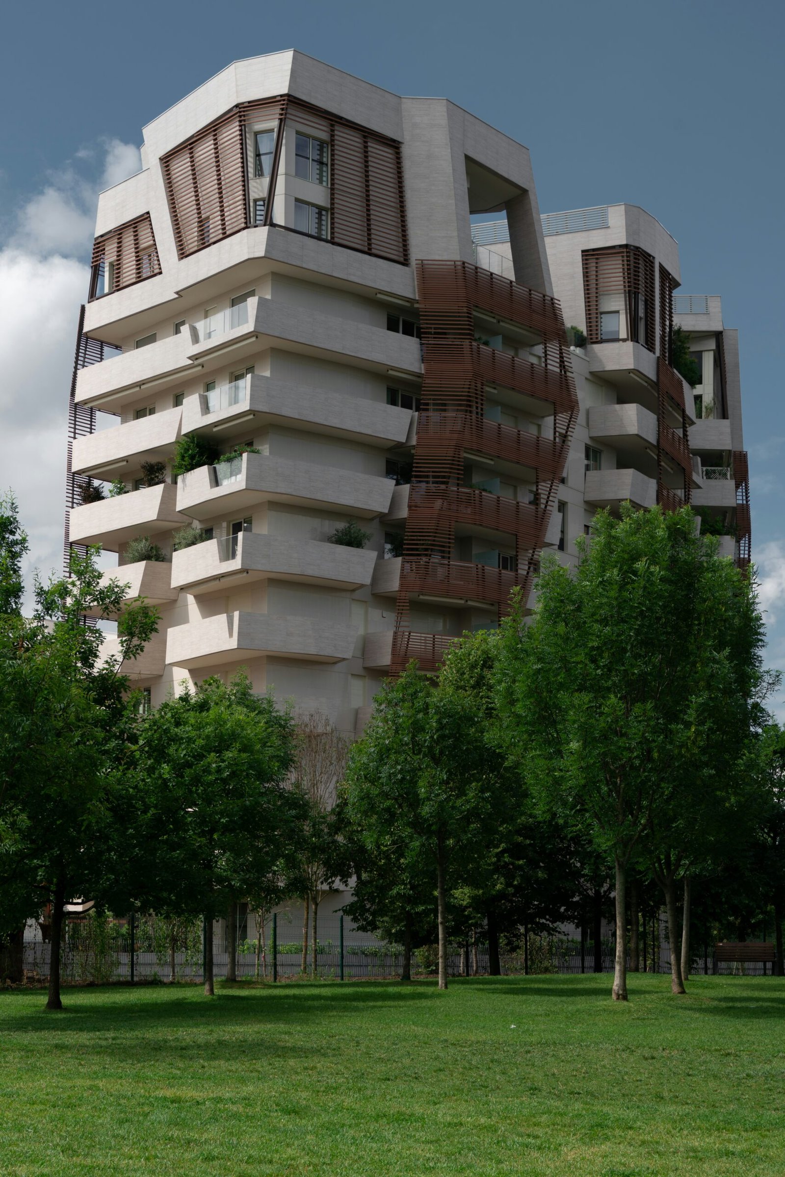 a tall building with balconies on top of it