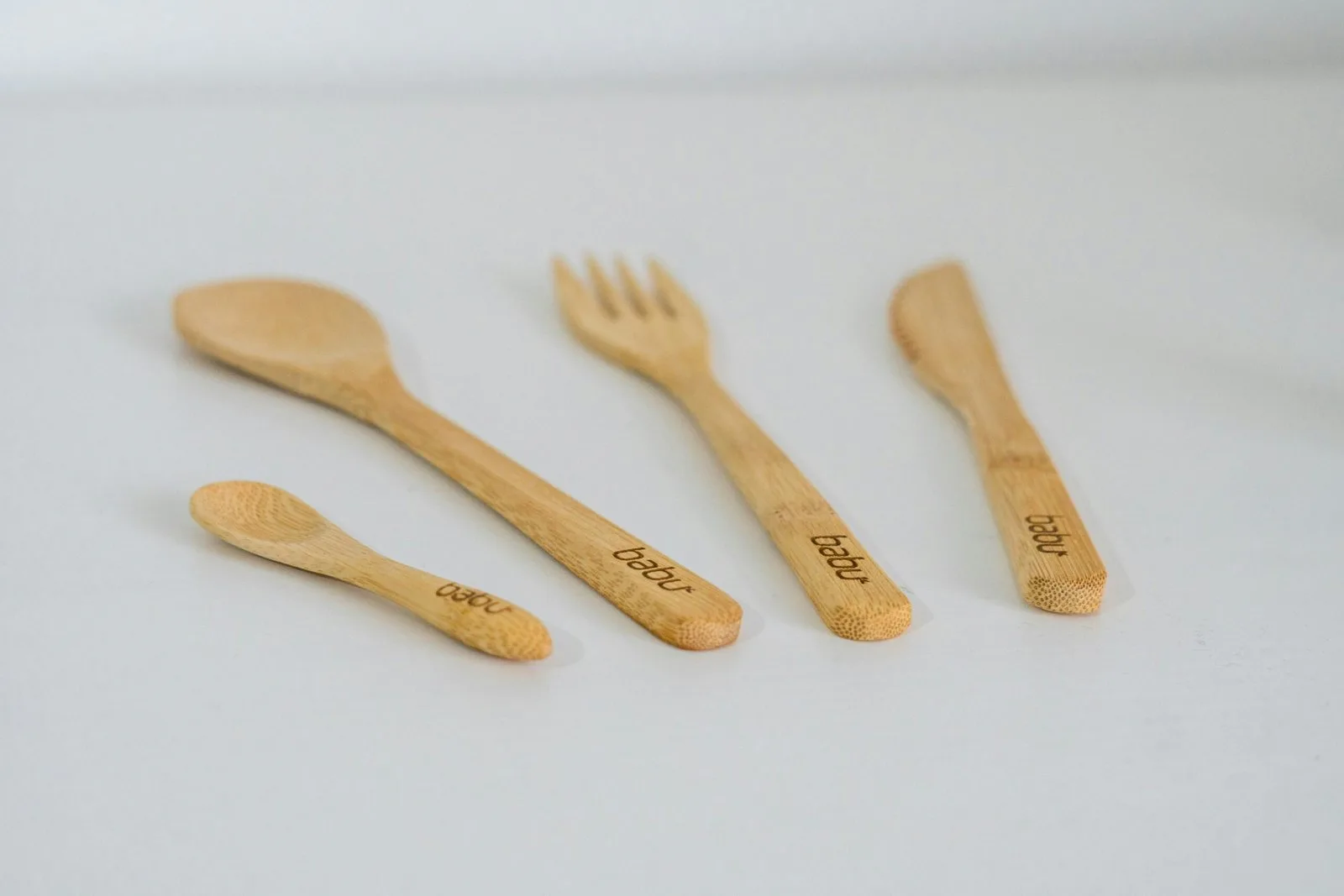 A group of wooden utensils sitting on top of a table