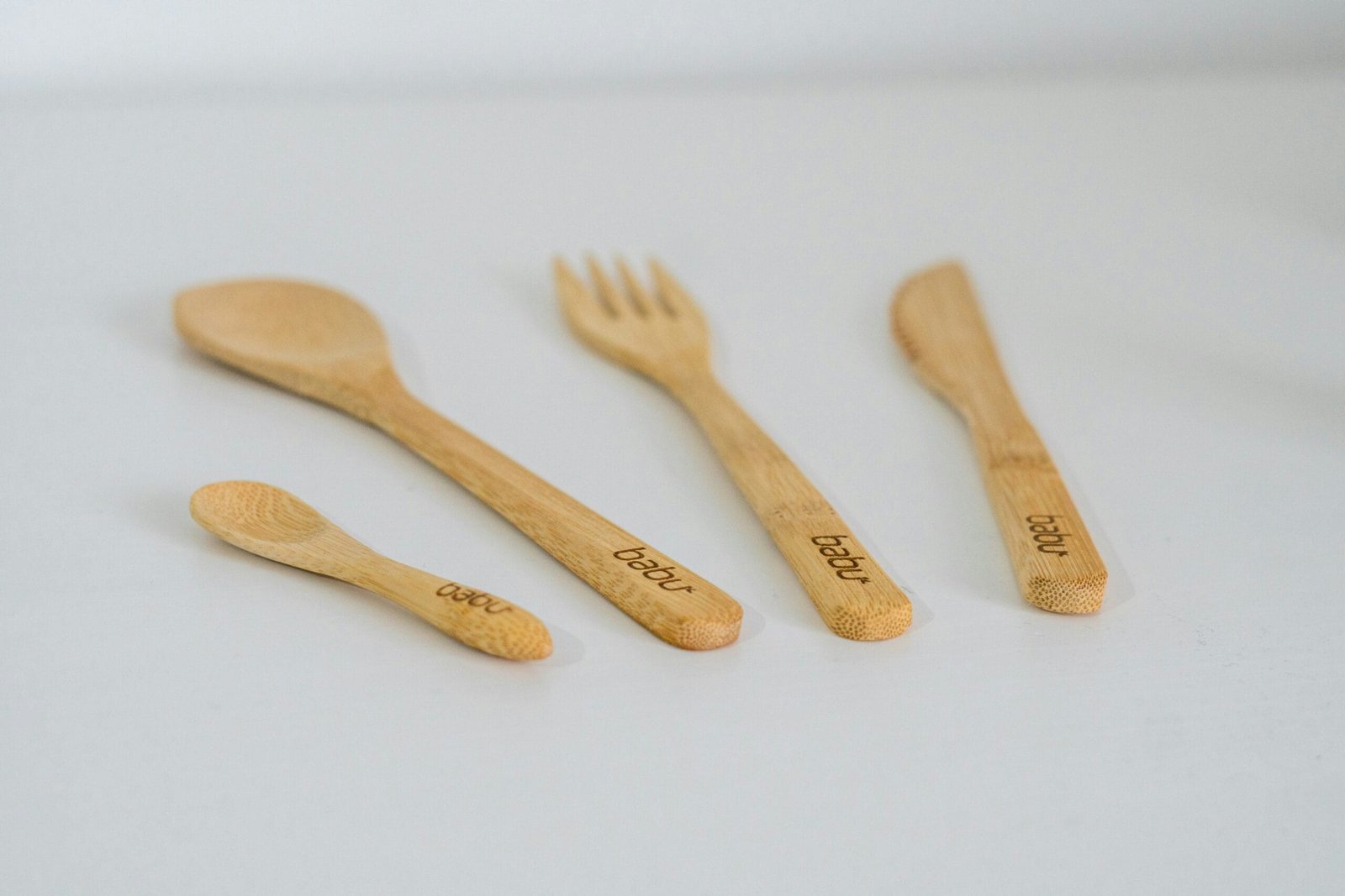 A group of wooden utensils sitting on top of a table