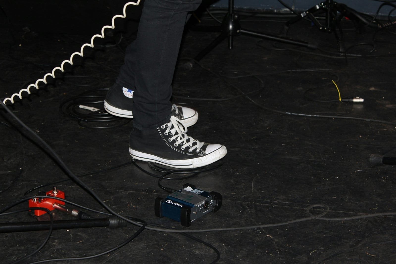 person standing beside white cable