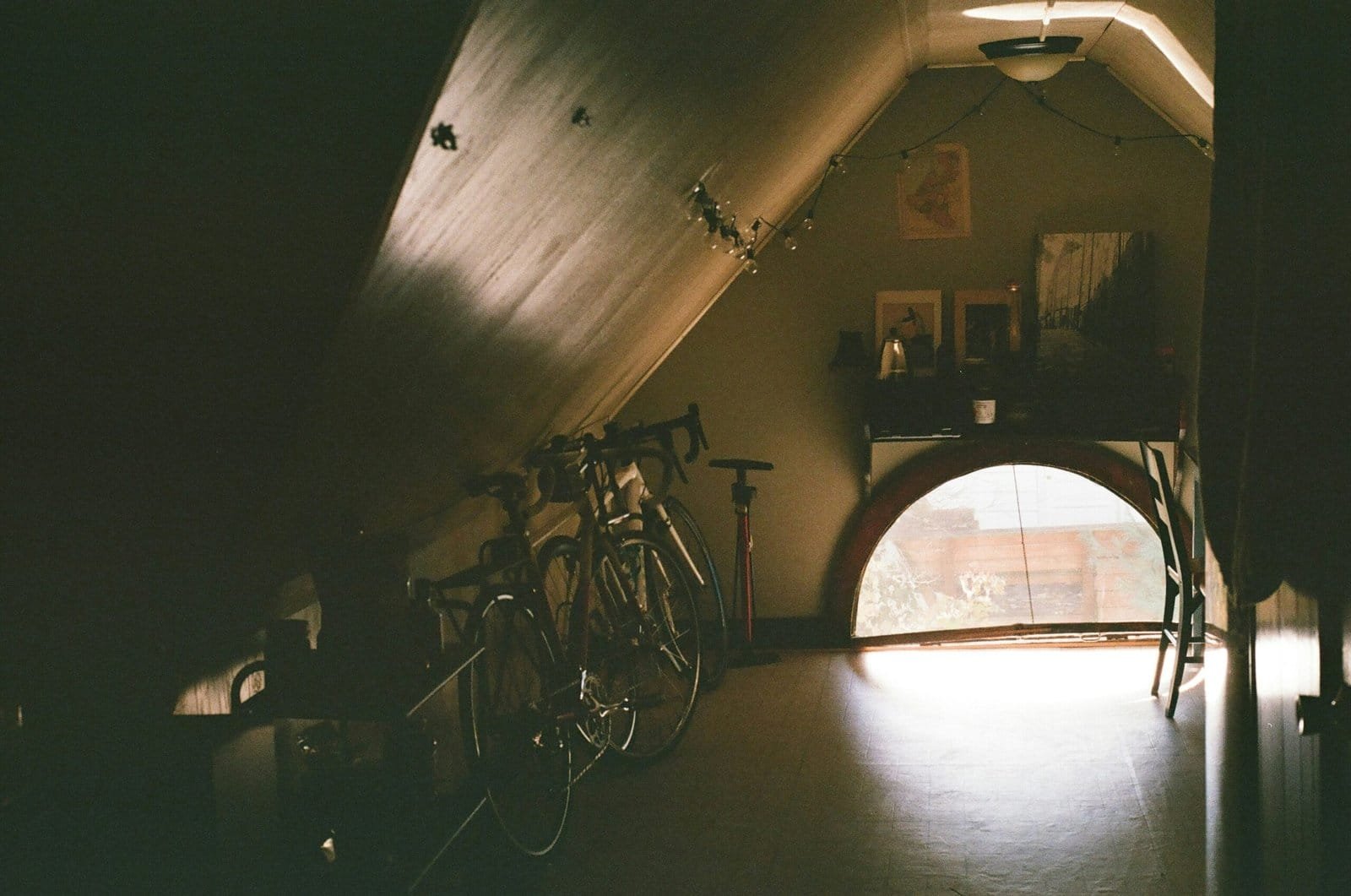 black bicycle near brown wooden cabinet